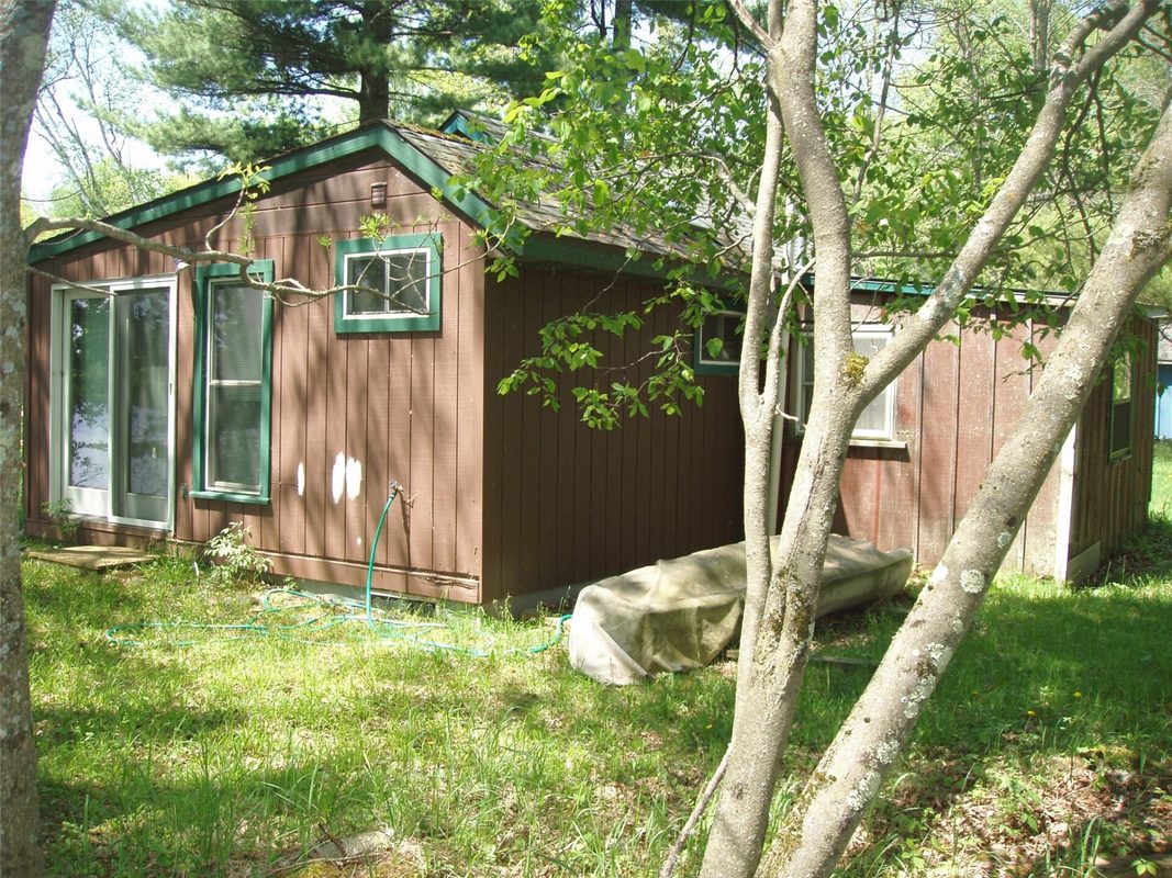 W11049 N LeTourneau Lake Road, Park Falls WI 54552 - side exterior in the trees