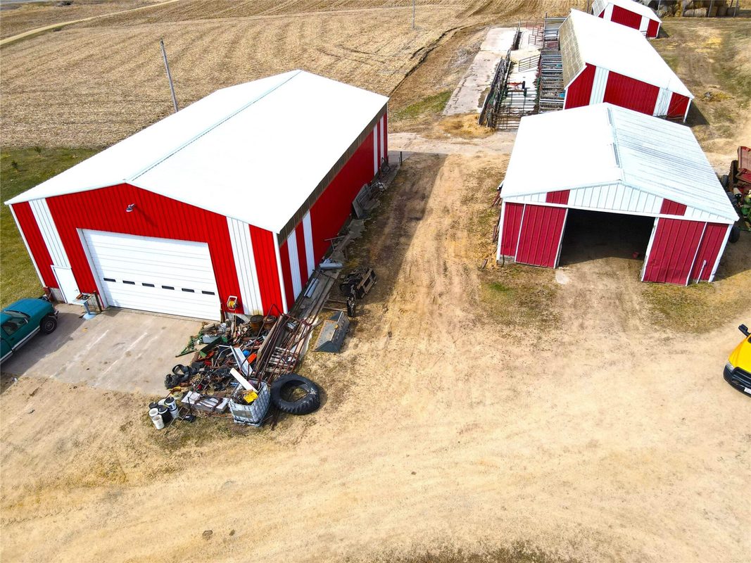 N41286 Halama Road, Independence WI 54747 - Two red metal pole buildings with overhead door and open equipment bay on gravel yard - MLS #1599441 - image14