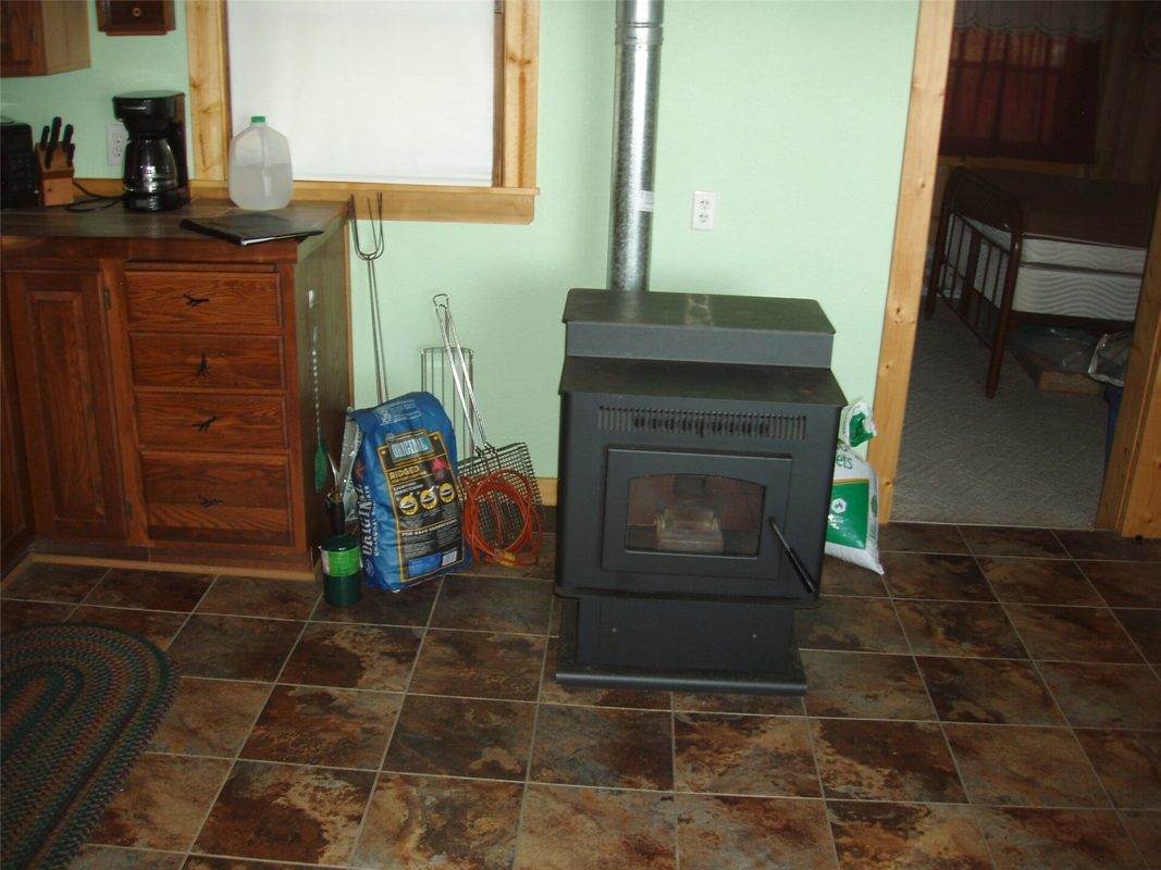 W11049 N LeTourneau Lake Road, Park Falls WI 54552 - living room with stove